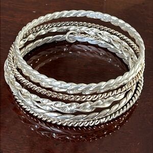 Set of 7 silver-tone stacking twisted wire Bangle Bracelets